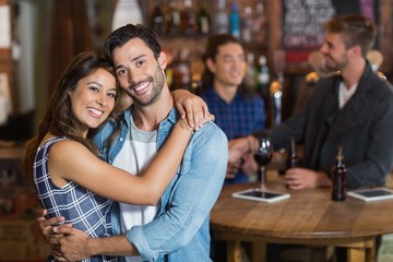 Smiling young couple embracing