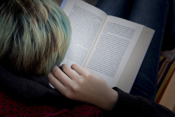 girl reads a book in outdoor