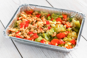 Healthy food in foil boxes, diet concept.
