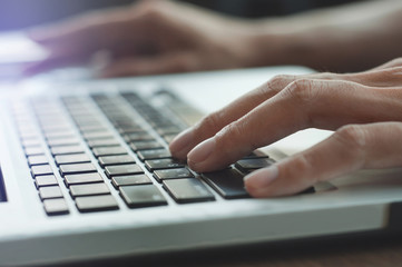 Fototapeta na wymiar close up hands typing keyboard laptop
