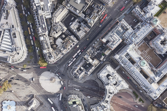Directly above view of traffic circle amongst buildings, London, England, UK