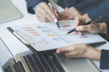 Team work process. Business working new startup project with laptop. managers meeting. Analyze plans, papers.