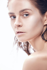Fototapeta premium Beautiful woman face portrait close up on blue