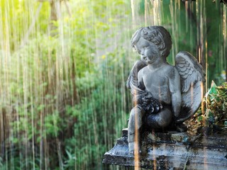 Naklejka na ściany i meble Cupid statue decorated on the fountain.