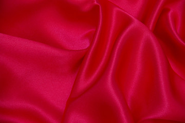 Red cloth waves background texture.