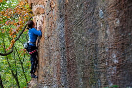 Rock climber ascending a sport route in Red River Gorge, Kentucky, on some wonderful sandstone.
