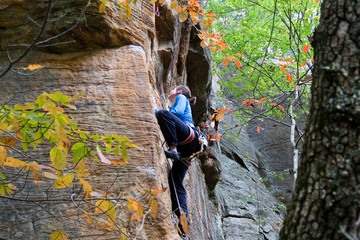 Rock climber ascending a sport route in Red River Gorge, Kentucky, on some wonderful sandstone.