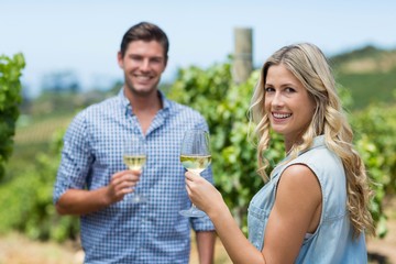 Portrait of happy couple holding wineglasses