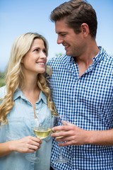 Young couple holding wineglasses