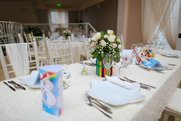 Wedding decoration table with flowers and raindows