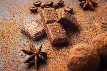 Chocolate truffle,Truffle chocolate candies with cocoa powder.Homemade fresh energy balls with chocolate.Gourmet assorted truffles made by chocolatier.Chunks of chocolate and coffee beans