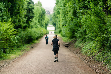 People running in beautiful green park
