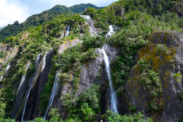 Waterfall at Franz Josef Glacier, Located in Westland Tai Poutini National Park on the West Coast of New Zealand