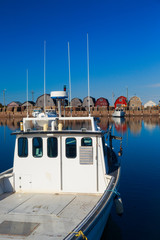 Commercial fishing boats at a wharf in rural Prince Edward Island, Canada.