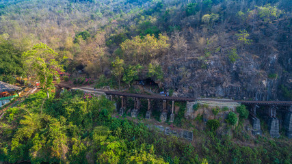 Fototapeta na wymiar Tham Krasae amazing railway pass the cliff and river
