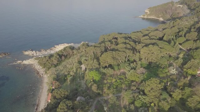 Flight over the mediterranean coastline on the border Italy France. Capo Mortola, Grimaldi (Ventimiglia), Italy, Europe. Aerial panoramic view 4K, UHD native log movie.