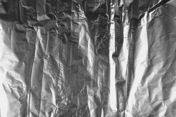 crumpled silver aluminum foil background, abstract texture