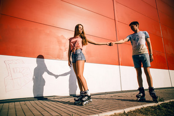 a couple roller-skating at sunset