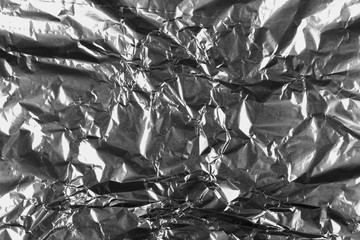 crumpled silver aluminum foil background, abstract texture