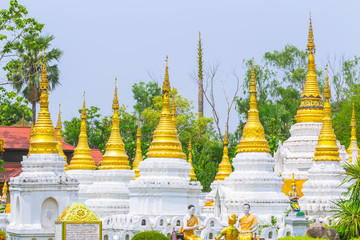 Golden white Pagoda in Thai Buddha temple in Lampang Thailand