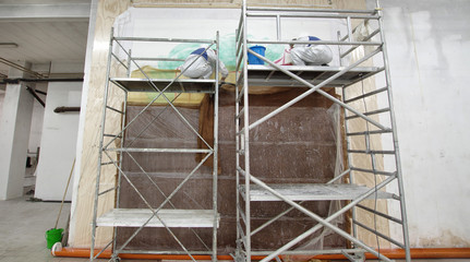 Restoration workers on a scaffold