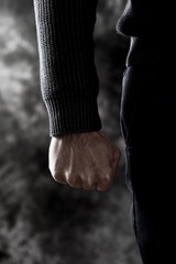 young man clenching his fist