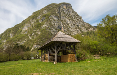 Fototapeta na wymiar Traditional wooden double hayrack in Bohinj, Slovenia during spring time