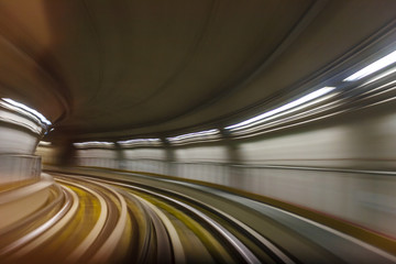 Obraz premium Inside tunel blur abstract scene traveling by train looking forward In Italian subway metro
