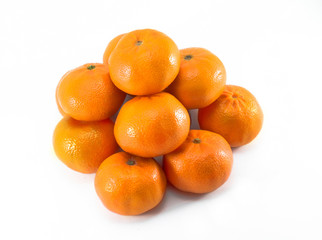 Orange mandarin pile isolated on white background.