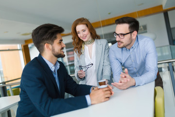 Business colleagues having conversation during coffee break