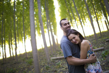 Happy young couple in love outdoor in summer