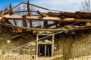 Fototapeta na wymiar Abandoned old houses in villages in the south-west of Ukraine