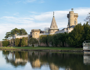 Reflection of Franzensburg Castle in the lakes of Laxenburg outside Vienna, Austria