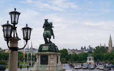 Fototapeta na wymiar Unidentified people walk past the Prinz Eugen - Reiterstatue of Heldenplatz in Vienna, Austria