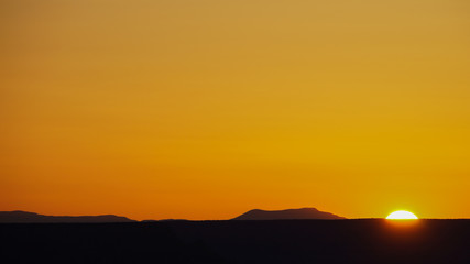 Orange sunset over the horizon of Grand Canyon national park