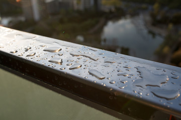Rain drops on rail