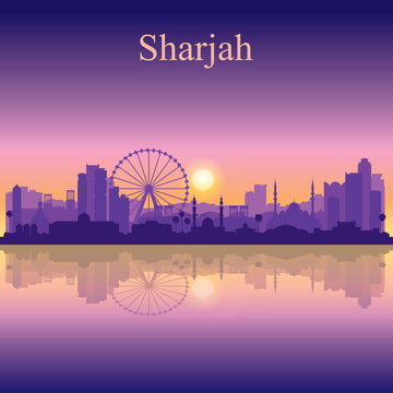Sharjah silhouette on sunset background
