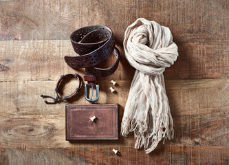  Woman clothes accessories and diary on wooden surface