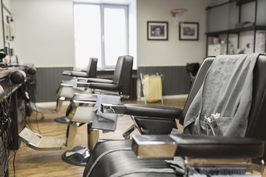 Row of empty chairs at barber shop