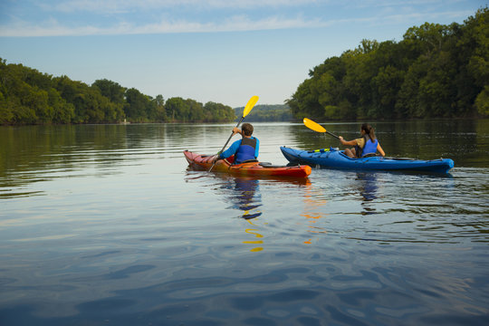 Couple kayaking in river