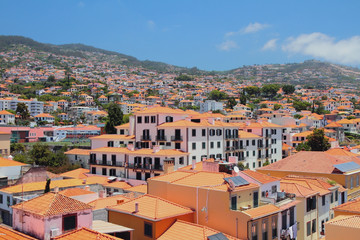 Fototapeta na wymiar City on hillside in sunny day. Funchal, Madeira, Portugal