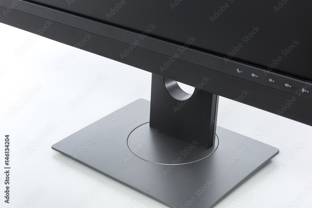 Aufkleber close up on supporting stand of a modern computer display