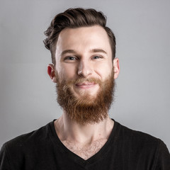 Obraz premium Exited young man isolated on gray background