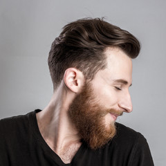 Obraz premium Shy young man isolated on gray backround