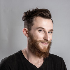 Obraz premium Shy young man isolated on gray backround