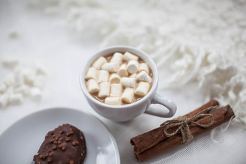 one white mug on a white background with marshmallow