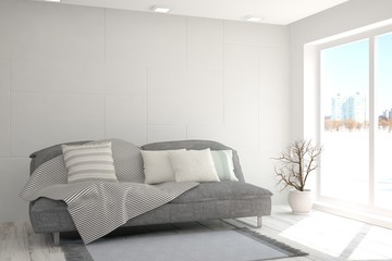 Fototapeta na wymiar White room with sofa and urban landscape in window. Scandinavian interior design. 3D illustration