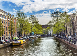 Fototapeta na wymiar Boats Reflection Bicycles Canal Amsterdam Holland Netherlands