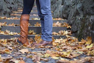 lovers by stone stairs in autumn