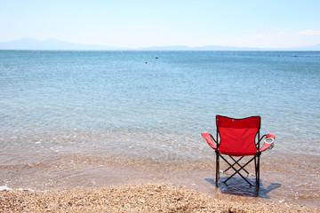 embty beach chair on the sea